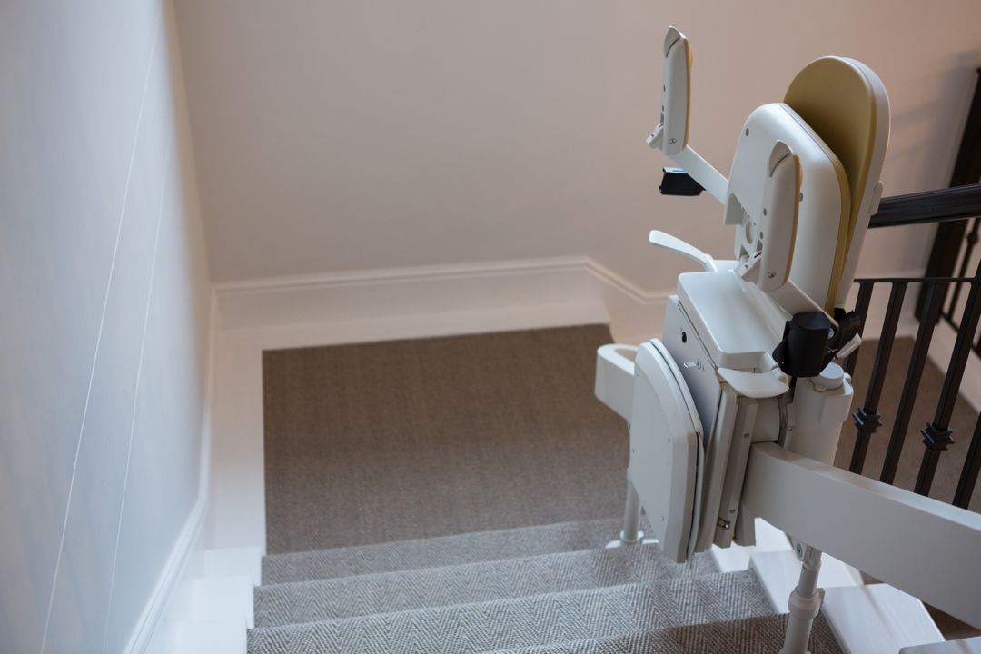 Close-up of Stairlift on Railing in Modern Home - Free Images, Stock Photos and Pictures on Pikwizard.com