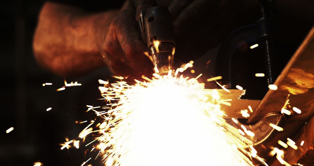 Metalworker Grinding with Sparks Flying in Workshop - Free Images, Stock Photos and Pictures on Pikwizard.com