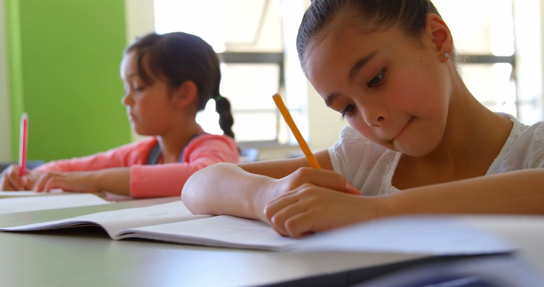 Focused Students Writing in Classroom Environment