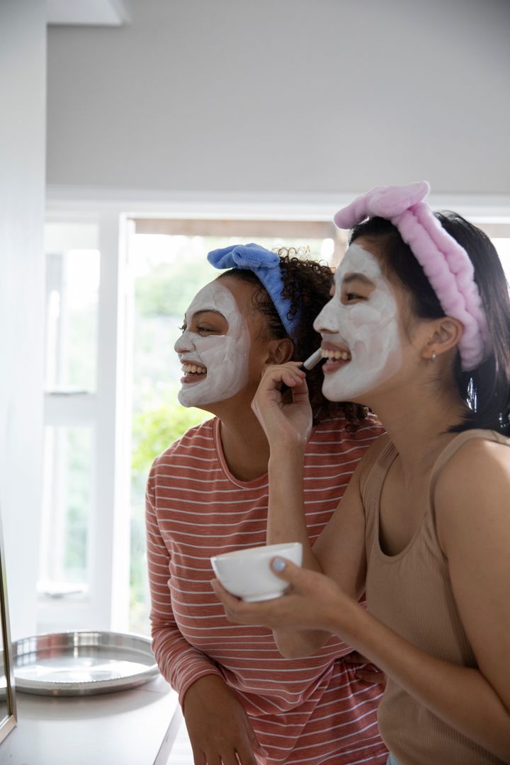 Diverse Friends Enjoying Skincare Routine at Home Vanity