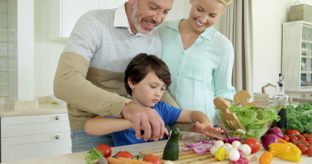 Parents Cooking with Child in Kitchen with Fresh Vegetables - Free Images, Stock Photos and Pictures on Pikwizard.com