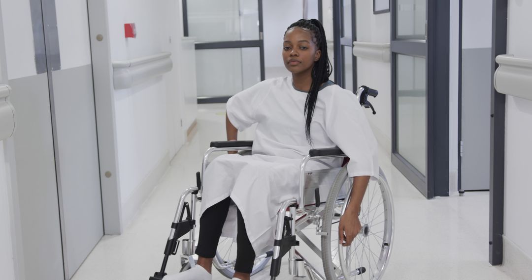 Young Woman in Wheelchair in Hospital Hallway - Free Images, Stock Photos and Pictures on Pikwizard.com