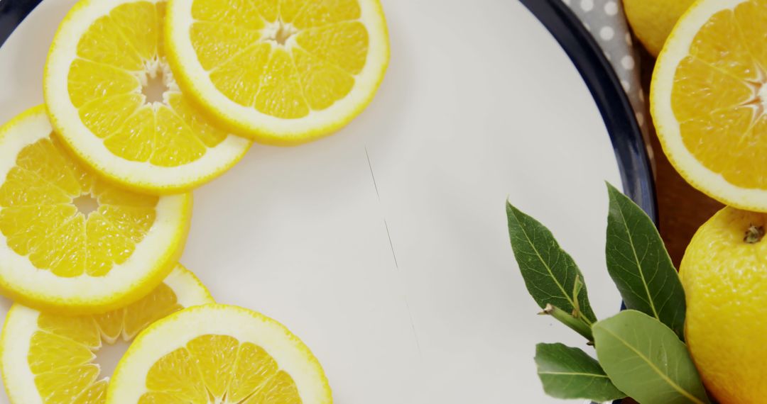 Sliced Lemons in Artistic Arrangement on Plate