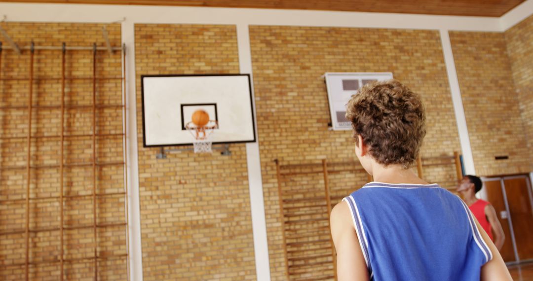 Teen Boys Playing Basketball in Gymnasium - Free Images, Stock Photos and Pictures on Pikwizard.com