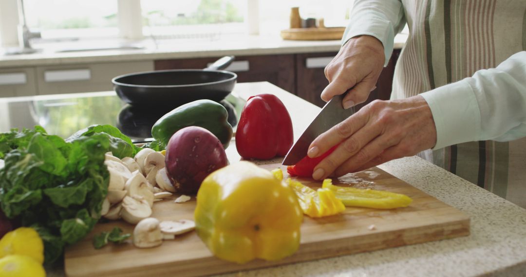 Close-Up of Person Cutting Fresh Vegetables in Modern Kitchen - Free Images, Stock Photos and Pictures on Pikwizard.com