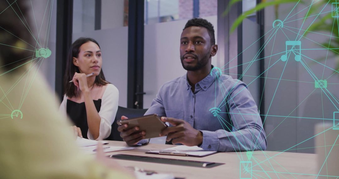 Diverse Team Exploring Digital Network Strategies in Modern Office