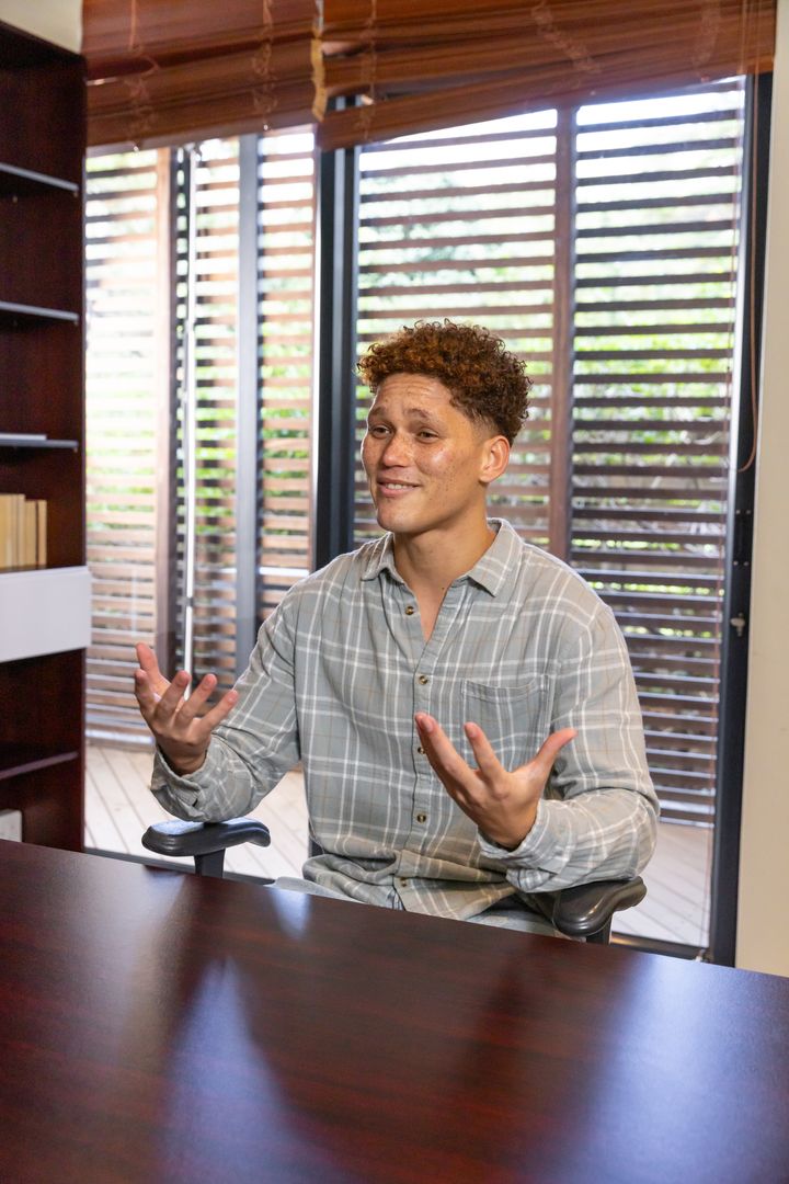 Person Engaging in Conversation in Modern Home Office