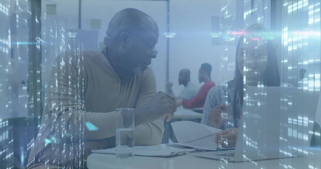 Senior Professional Collaboration in Modern Office with Technology Overlay