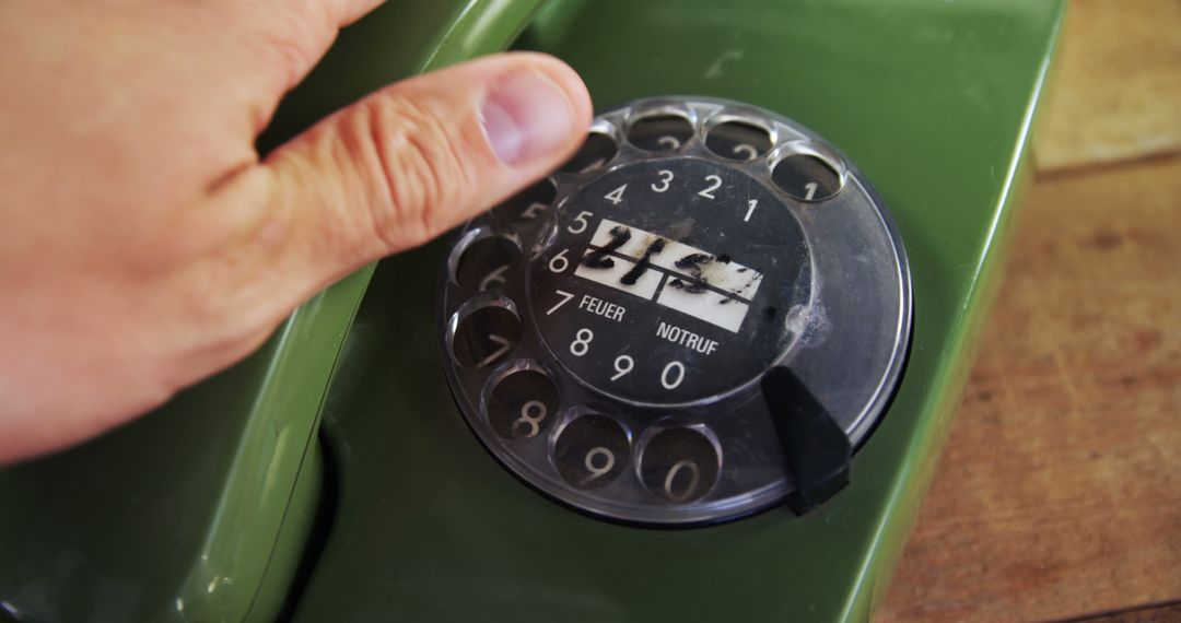 Close-Up of a Hand Dialing Rotary Telephone - Free Images, Stock Photos and Pictures on Pikwizard.com