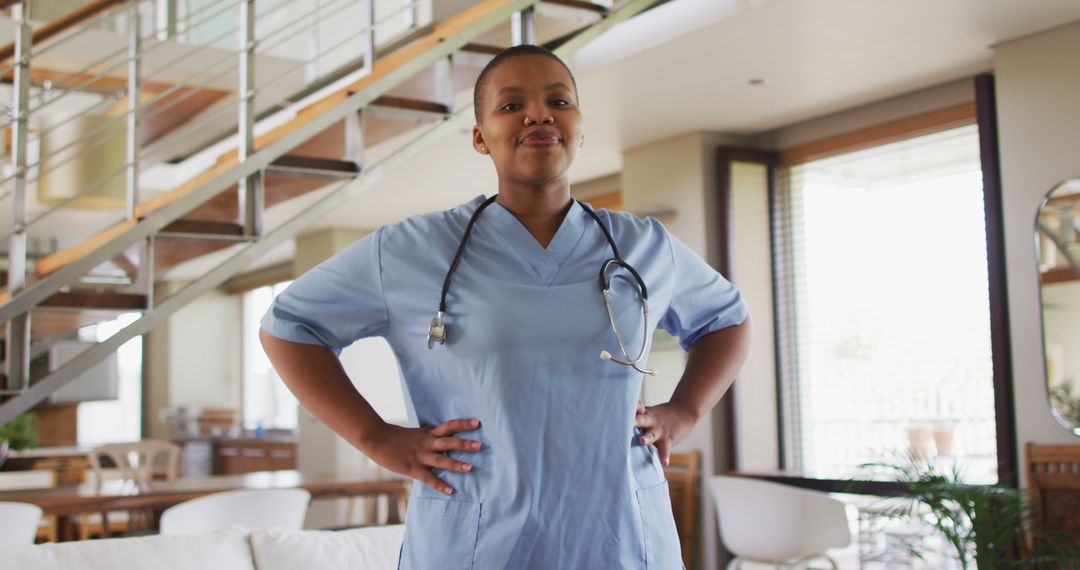 Confident Nurse Standing with Hands on Hips in Modern Home Interior - Free Images, Stock Photos and Pictures on Pikwizard.com