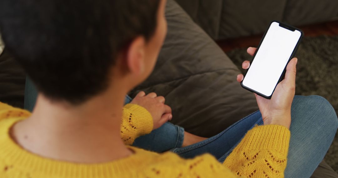 Person Using Smartphone with Blank Screen at Home - Free Images, Stock Photos and Pictures on Pikwizard.com