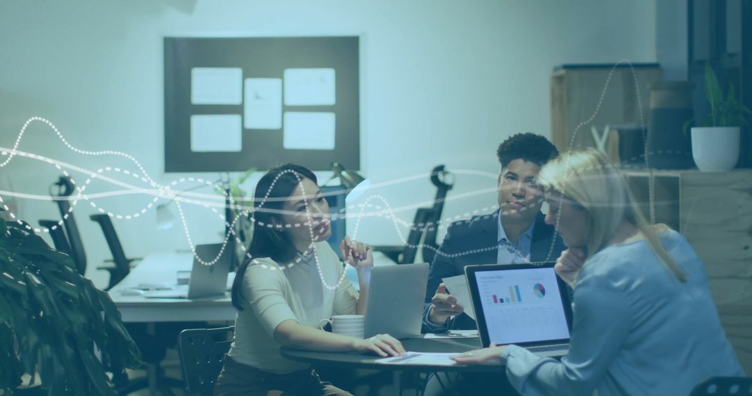 Team Collaboration Analyzing Data and Charts in Office Conference Room