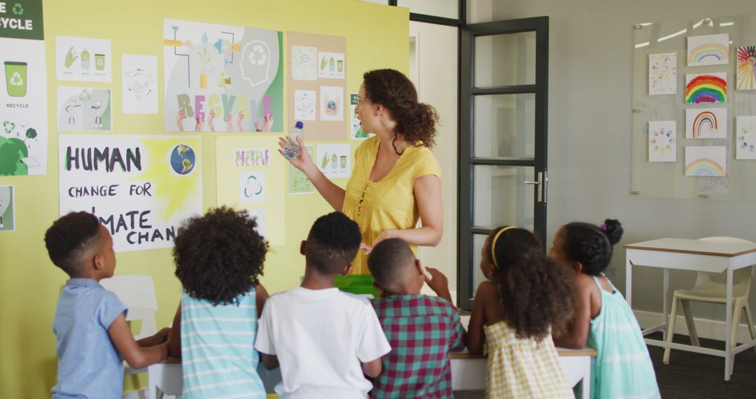 Teacher Discussing Climate Change with Diverse Group of Children in Classroom - Free Images, Stock Photos and Pictures on Pikwizard.com