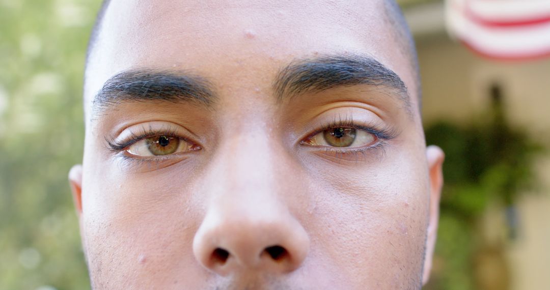 Close-up Portrait of Young Man with Focused Eyes - Free Images, Stock Photos and Pictures on Pikwizard.com