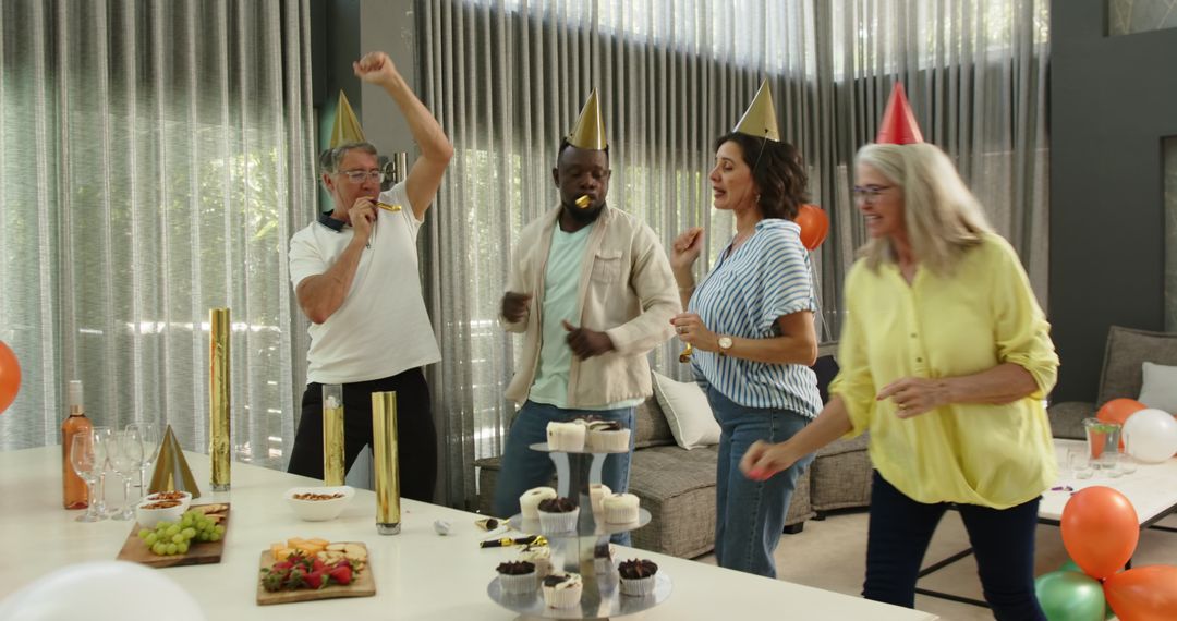 Colleagues Joyfully Celebrating Office Party with Hats and Trumpets