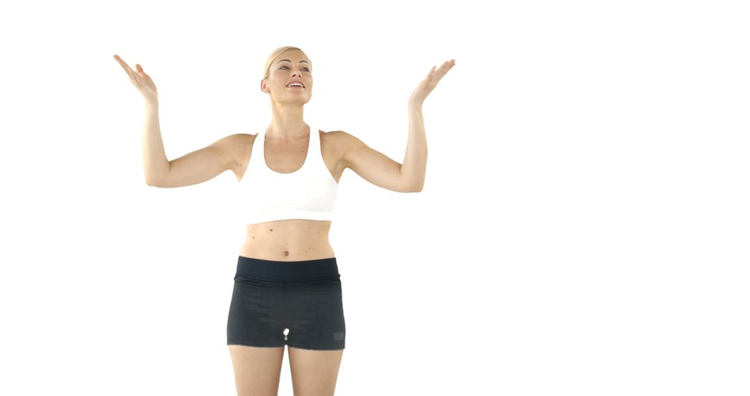 Energized Woman Excercising in Studio, Wearing Sports Attire - Free Images, Stock Photos and Pictures on Pikwizard.com