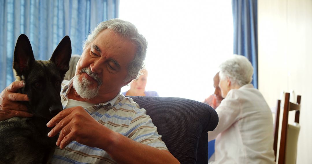 Senior Man with Dog at Nursing Home Social Gathering - Free Images, Stock Photos and Pictures on Pikwizard.com