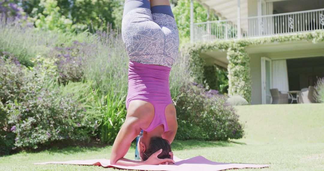 Woman Practicing Headstand Outdoors in Garden - Free Images, Stock Photos and Pictures on Pikwizard.com