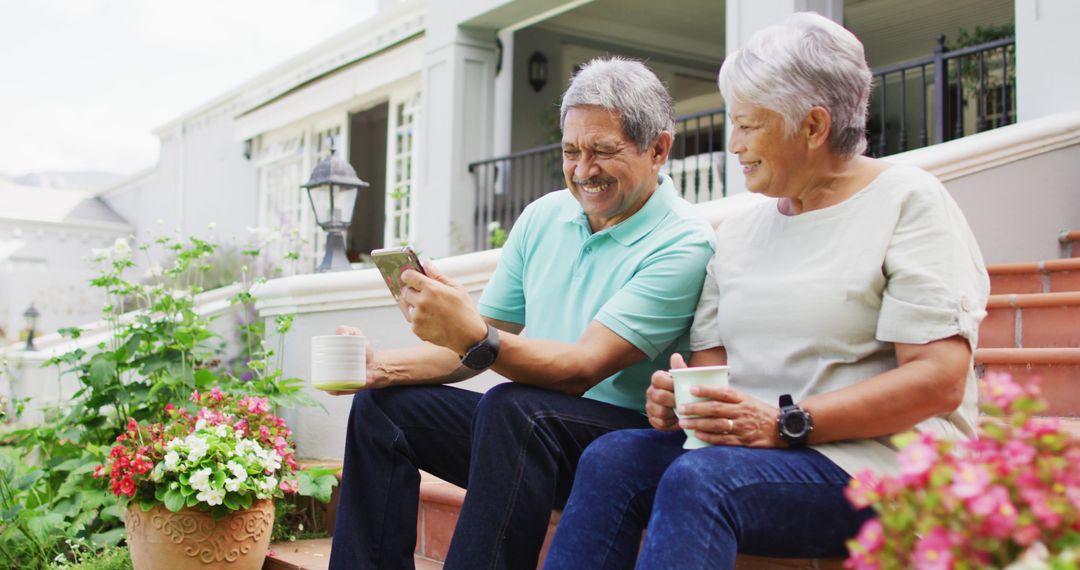 Senior Couple Enjoying Morning Coffee on Front Porch - Free Images, Stock Photos and Pictures on Pikwizard.com