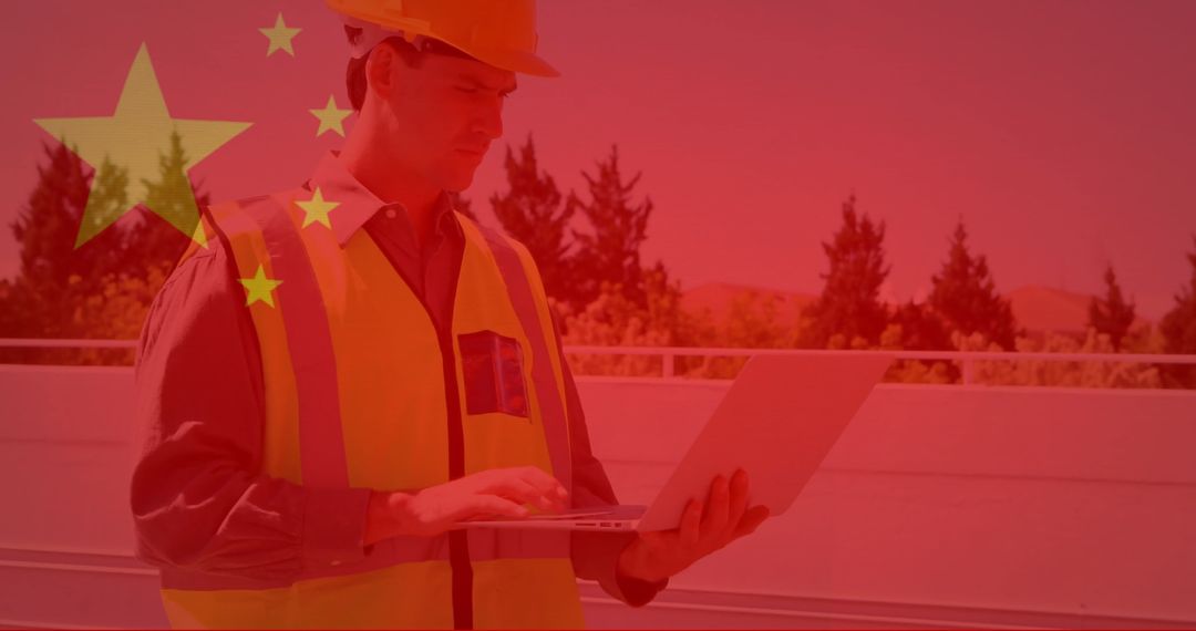 Engineer Inspecting Solar Panels with Futuristic Red Overlay