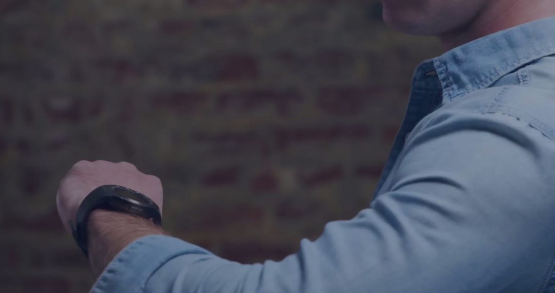Caucasian Man Interacting with Smartwatch Technology