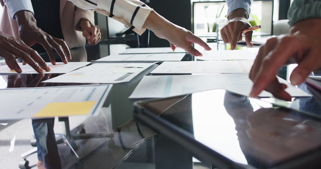 Diverse Team Collaborating and Discussing Project Plans in Office