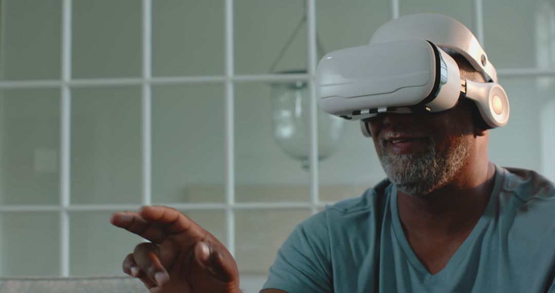 Senior Man Immersed in Virtual Reality Technology at Home
