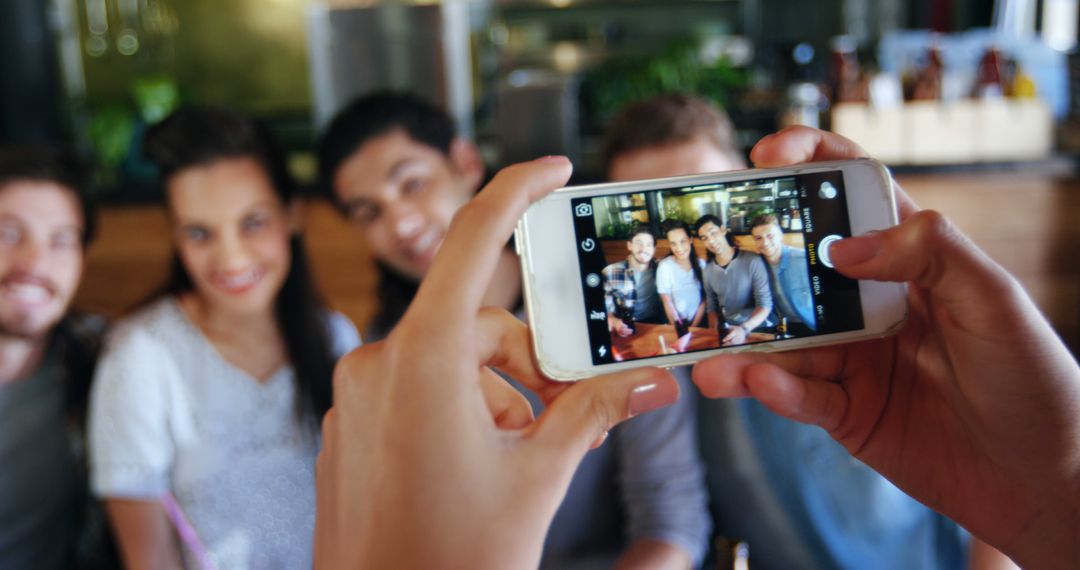 Friends Posing for a Group Selfie at Cafe with Smartphone - Free Images, Stock Photos and Pictures on Pikwizard.com