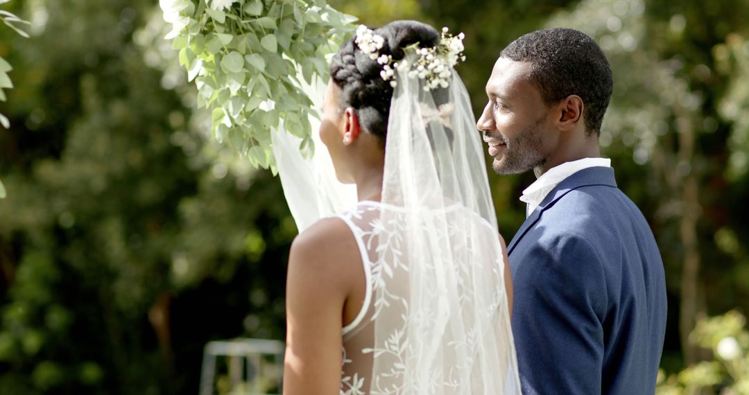 Joyful Bride and Groom Celebrating in Sunlit Garden - Free Images, Stock Photos and Pictures on Pikwizard.com