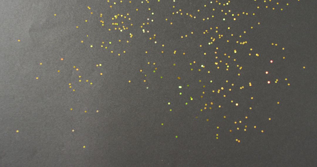 Scattered Gold Glitter Sparkles on Black Background - Free Images, Stock Photos and Pictures on Pikwizard.com