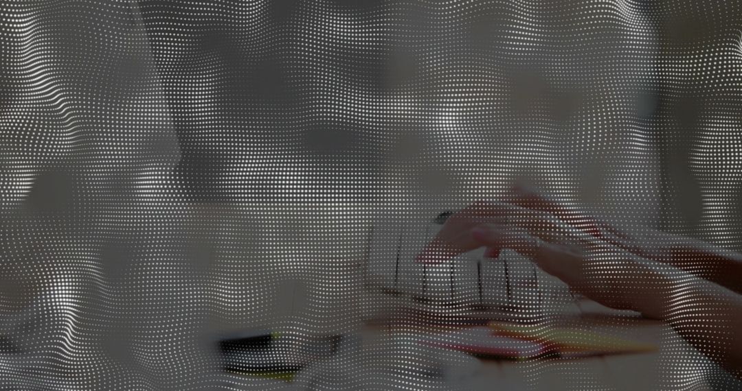 Halftone Dot Wave Overlay Transforming Office Workspace into Futuristic Digital Texture