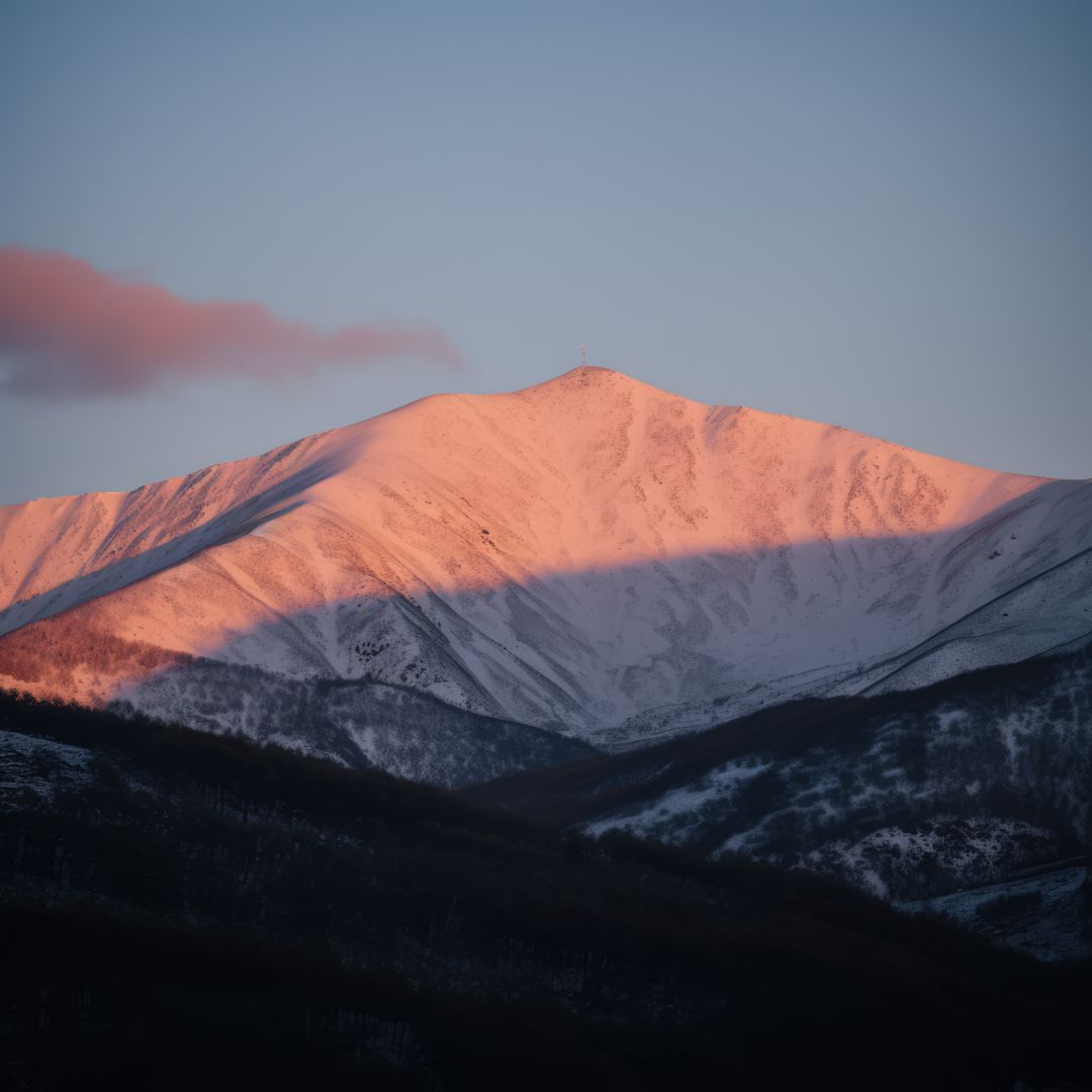 Sunset bathes a snowy mountain peak in warm light - Free Images, Stock Photos and Pictures on Pikwizard.com