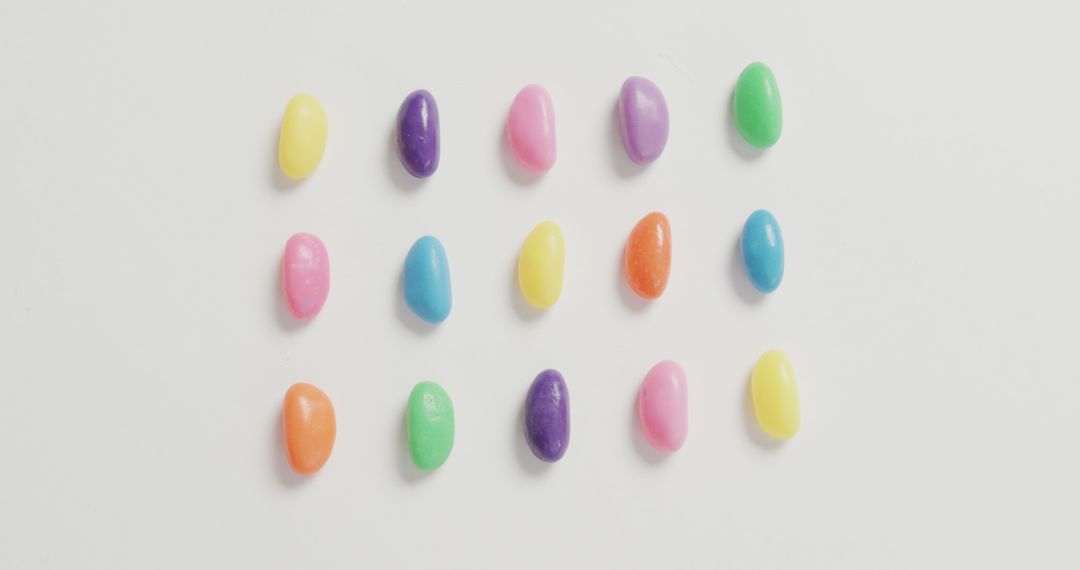 Colorful Assorted Jelly Beans Arranged in Rows on White Background - Free Images, Stock Photos and Pictures on Pikwizard.com