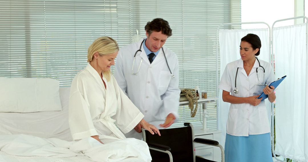 Patient Consults with Doctors in Hospital Room - Free Images, Stock Photos and Pictures on Pikwizard.com