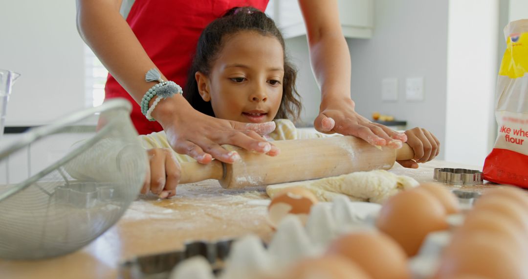 Mother and Daughter Baking Together in Kitchen Rolling Dough - Free Images, Stock Photos and Pictures on Pikwizard.com