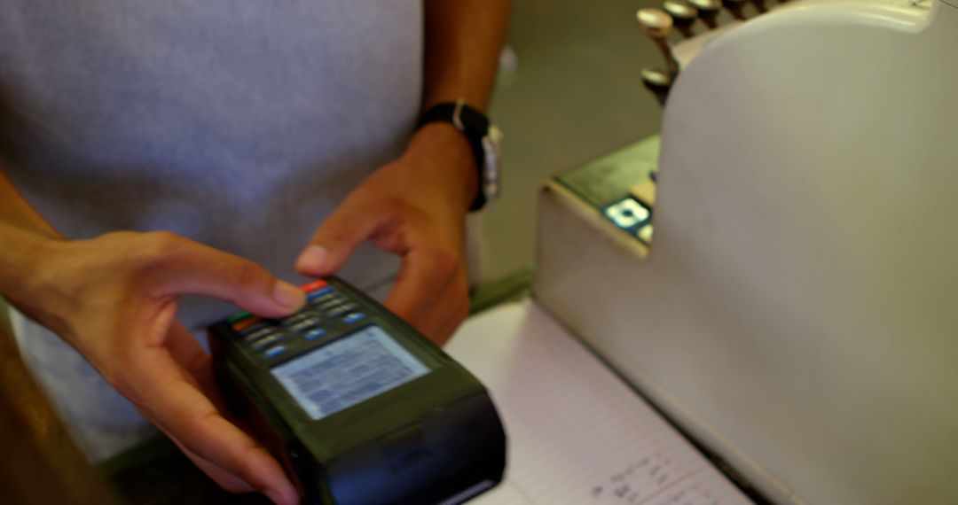 Cashier Handling Credit Card Transaction with Modern Terminal - Free Images, Stock Photos and Pictures on Pikwizard.com