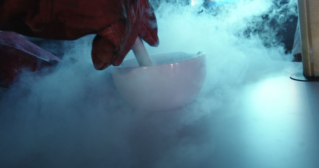 Scientist using mortar and pestle with liquid nitrogen creating mist - Free Images, Stock Photos and Pictures on Pikwizard.com