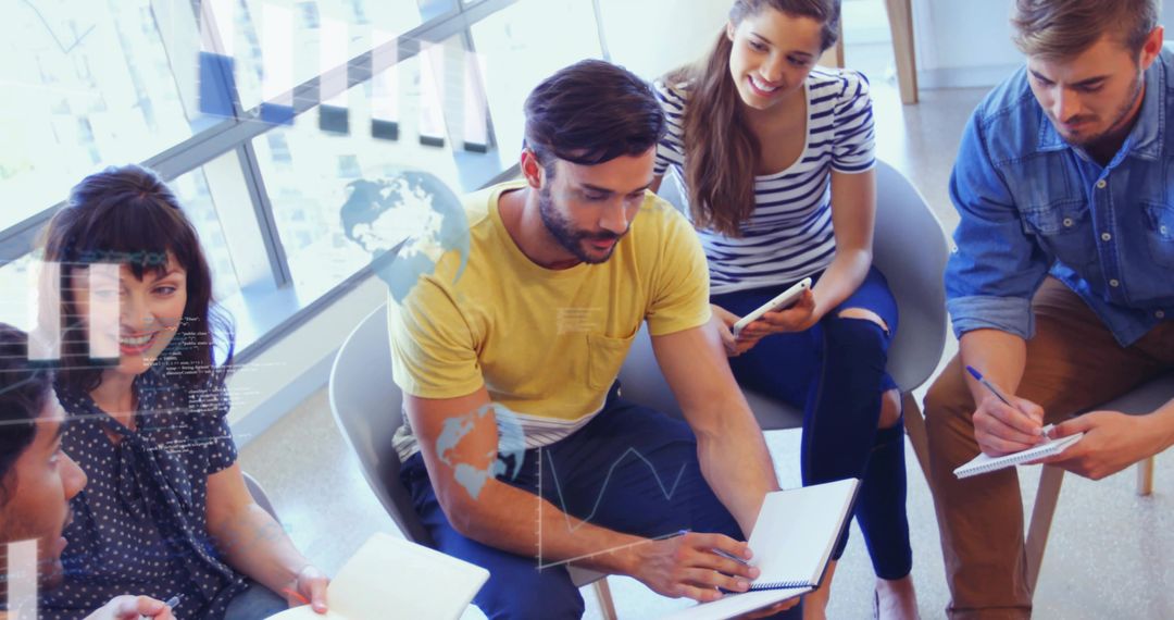 Creative Team Journaling Ideas Together Near Large Window