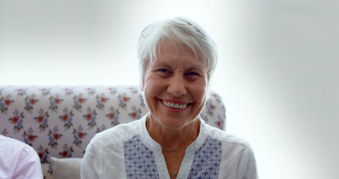 Smiling Senior Woman Relaxing in Nursing Home Setting