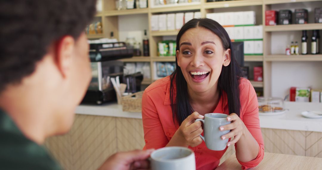 Laughing Woman Enjoying Coffee with Friend in Cafe - Free Images, Stock Photos and Pictures on Pikwizard.com