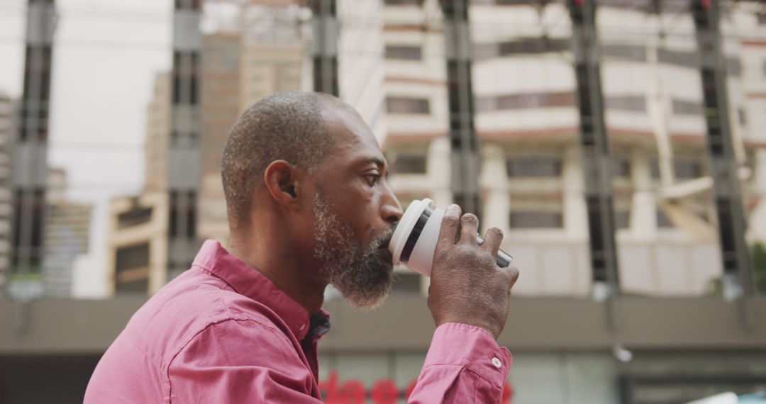 Man Drinking Coffee Outdoors in Urban Area - Free Images, Stock Photos and Pictures on Pikwizard.com