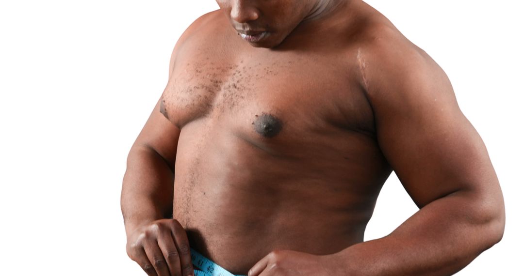 An African American middle-aged man appears shirtless, examining his own abdomen, with copy space - Free Images, Stock Photos and Pictures on Pikwizard.com