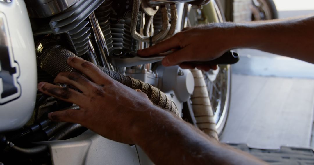 Close-up of Mechanic Repairing Motorcycle Engine in Workshop - Free Images, Stock Photos and Pictures on Pikwizard.com