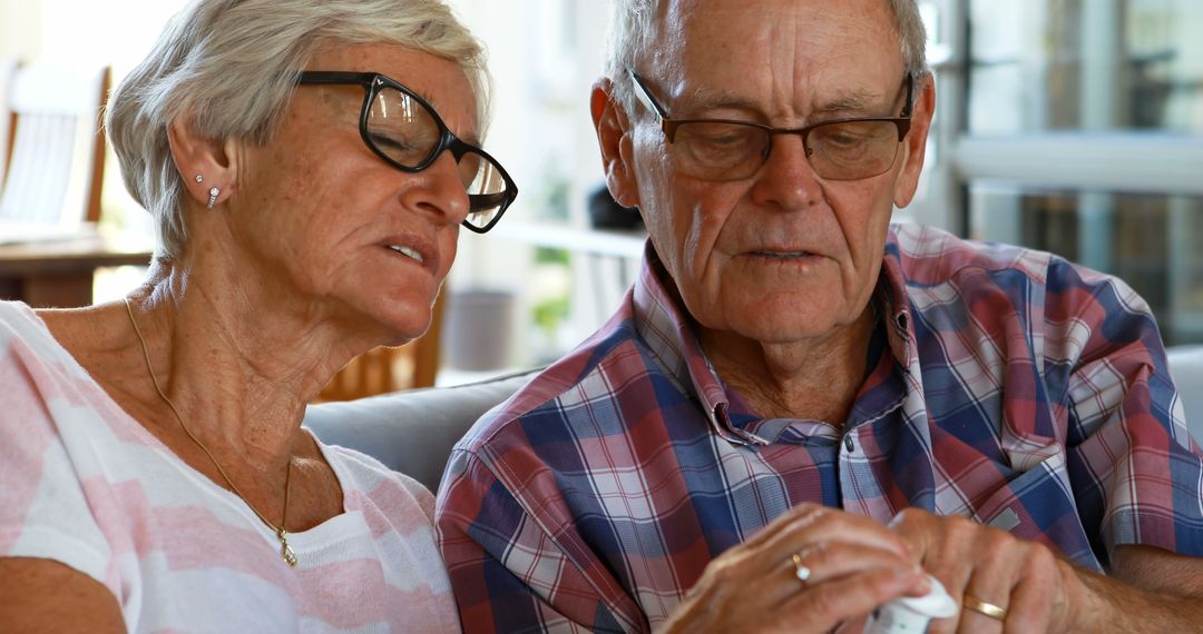 Senior Couple Collaborating on Small Project at Home