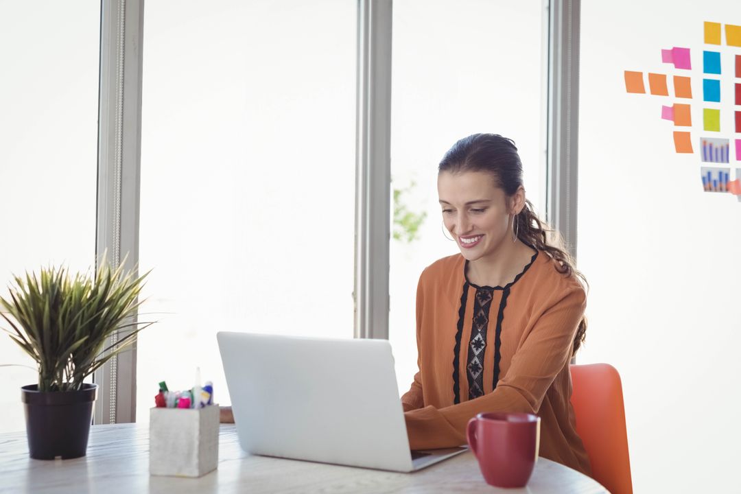 Smiling Woman Working at Bright Modern Workspace