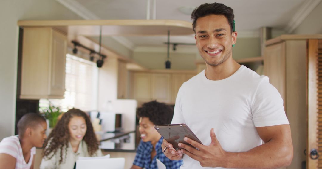 Confident Man Holding Tablet with Multicultural Friends