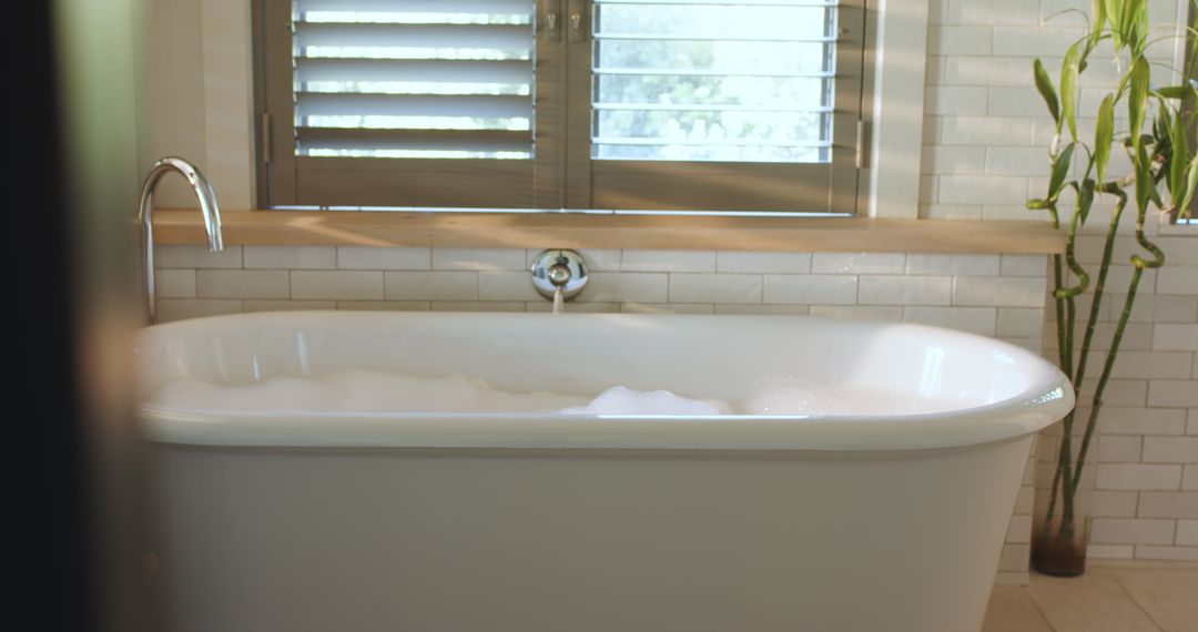 Luxurious Bathtub with Fresh Bubbles and Sunlit Ambiance