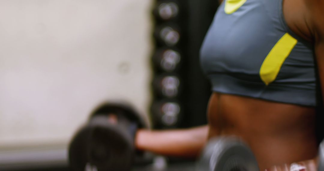 Close-Up of Athlete Lifting Dumbbells in Gym - Free Images, Stock Photos and Pictures on Pikwizard.com