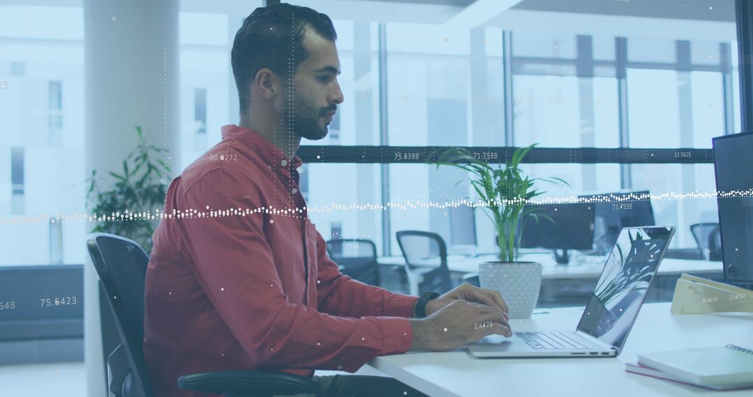 Businessman using laptop with data overlay feature visualizing analytics