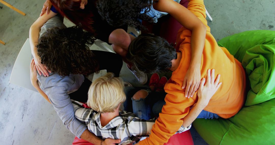 Top View of Diverse Friends Forming Group Hug - Free Images, Stock Photos and Pictures on Pikwizard.com